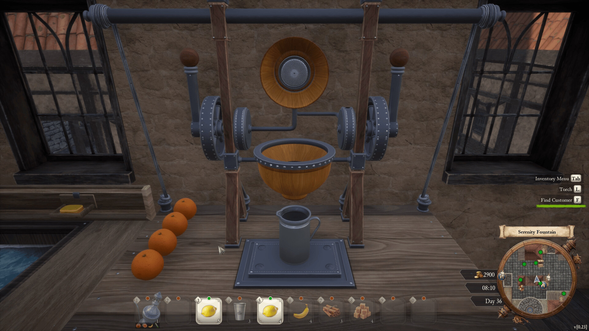 Close-up of a mechanical citrus juicer with oranges on the workbench and a metal pitcher positioned below the press.